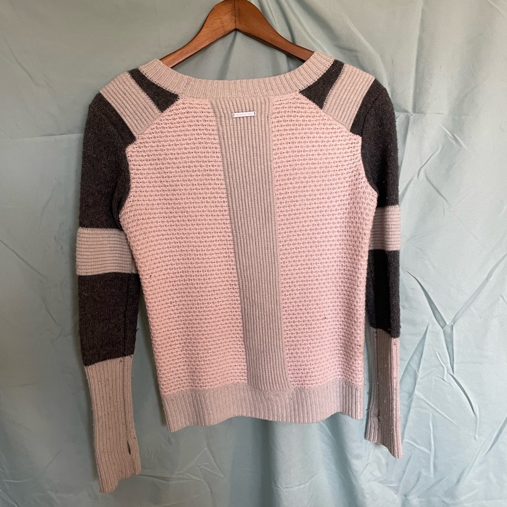 This Blanc Noir pastel sweater will keep you looking fresh and warm.